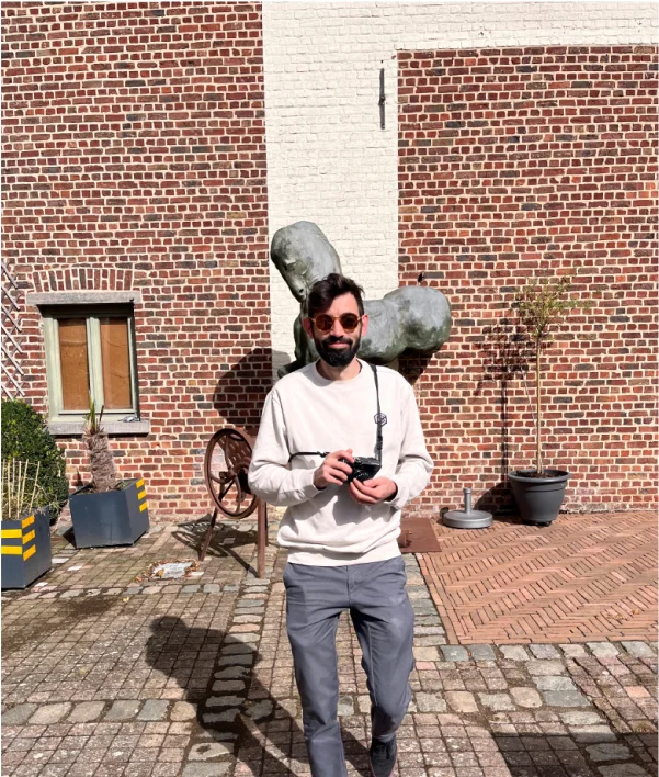 One guy standing with a camera