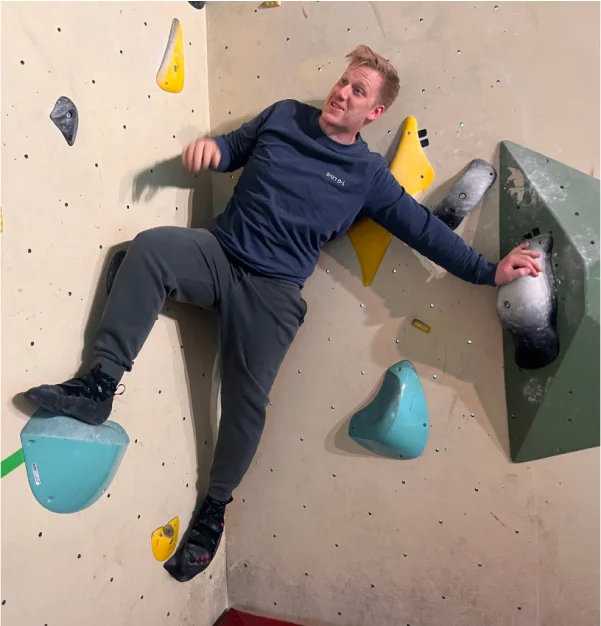 One guy climbing in a strange pose