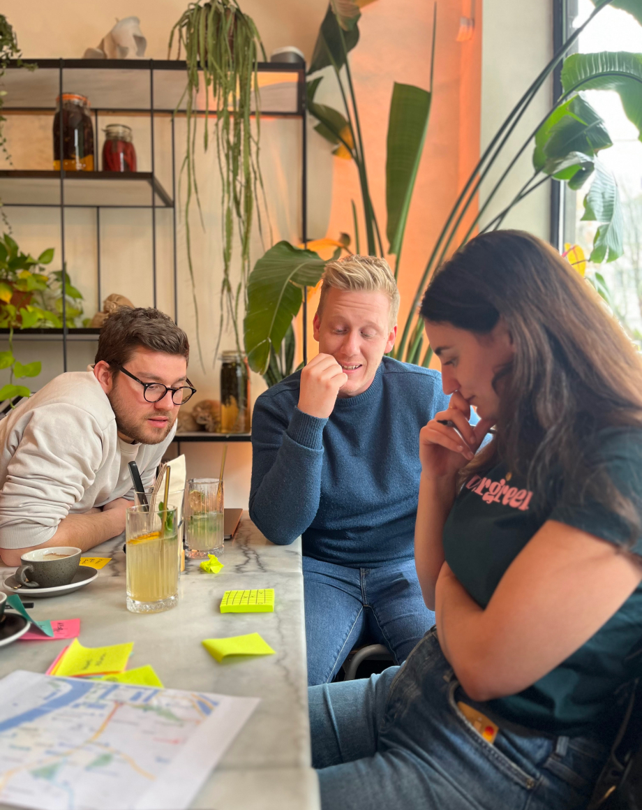 Three colleagues playing OXO together